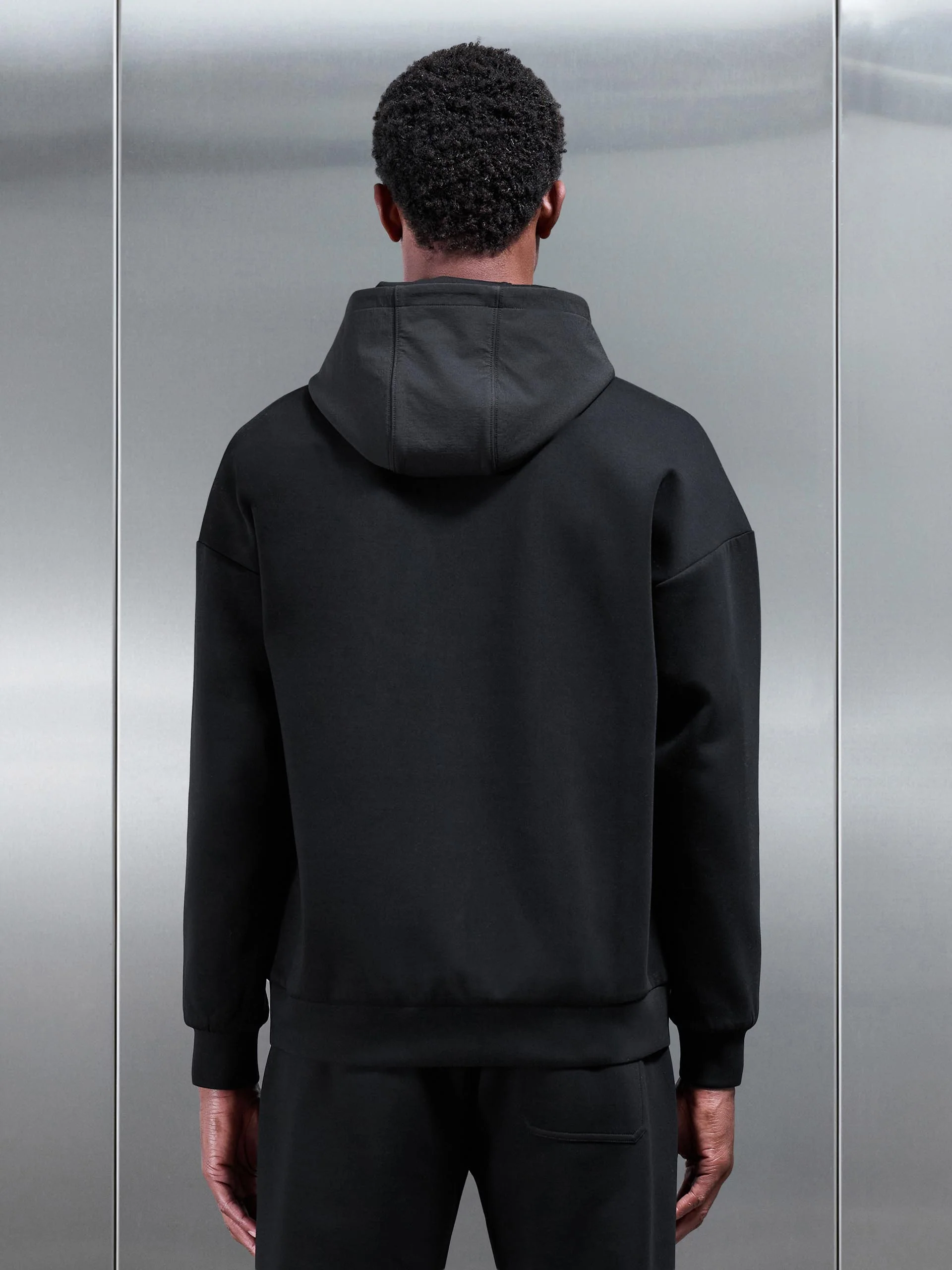 Interlock Jersey Hybrid Relaxed Hoodie in Black - Image 3