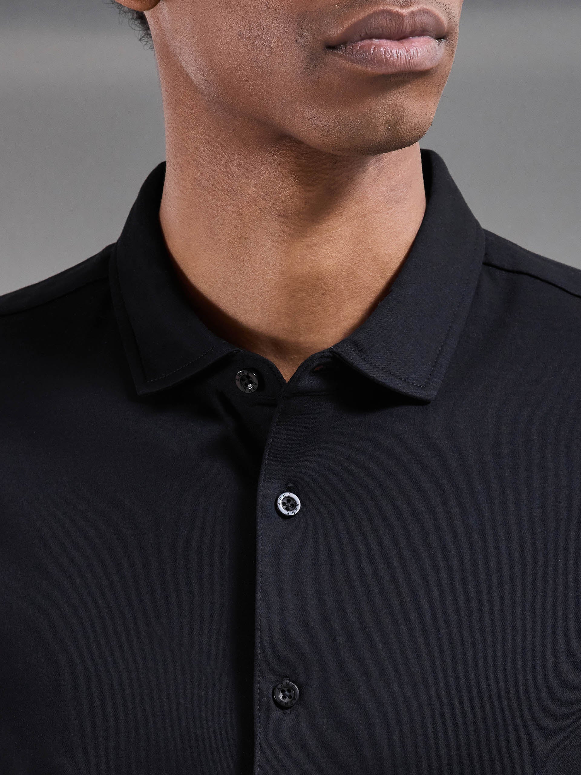 Mercerised Interlock Button Through Shirt in Black - Image 4